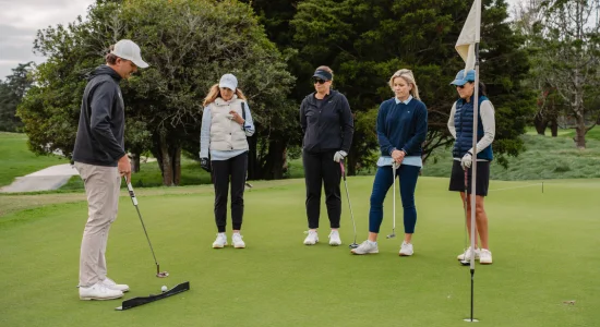 She Loves Golf Female Golfers During a Lesson